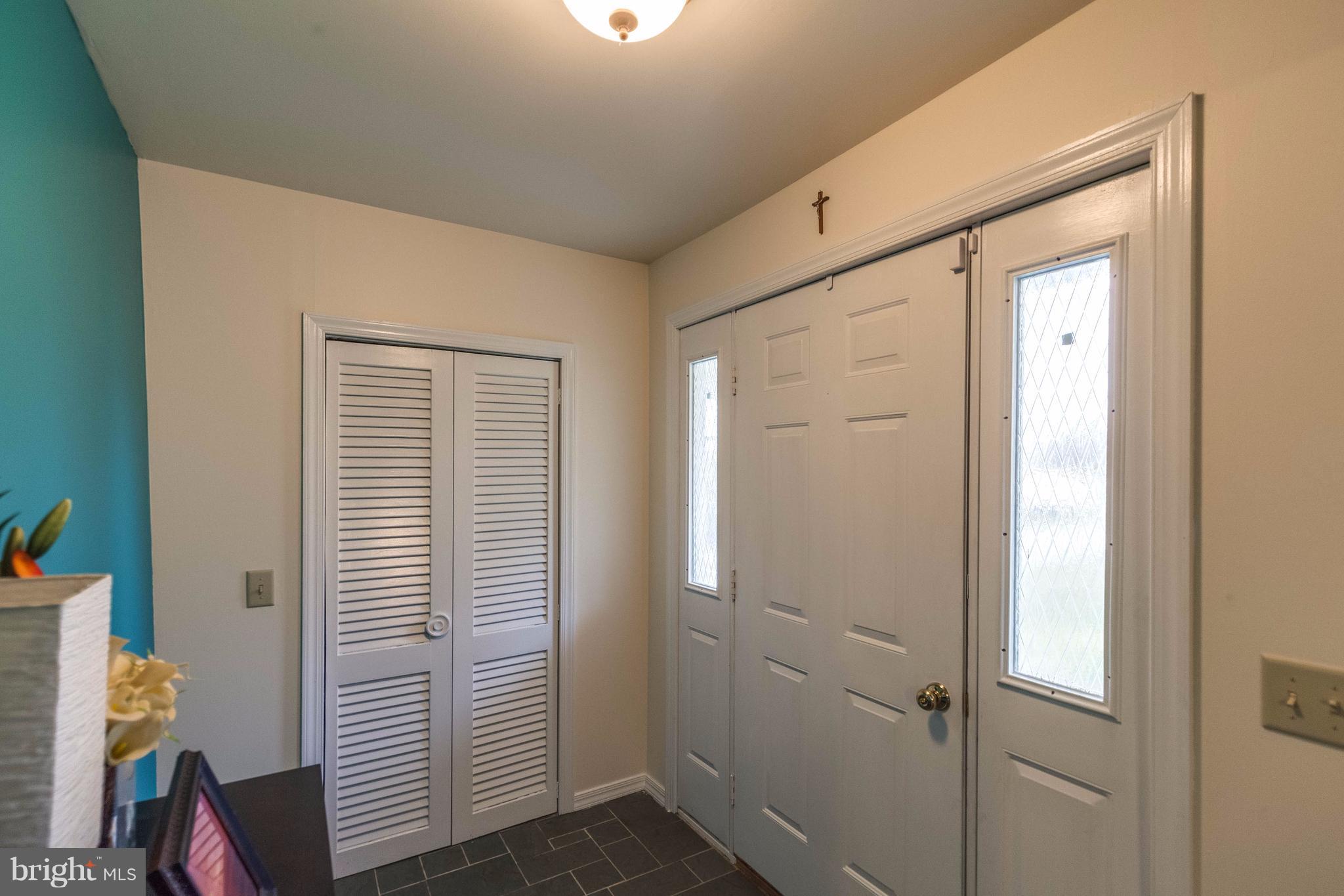 25453 Highfield Road Cascade, MD 21719 - Photo 9 of 30 a view of a hallway with closet and a window