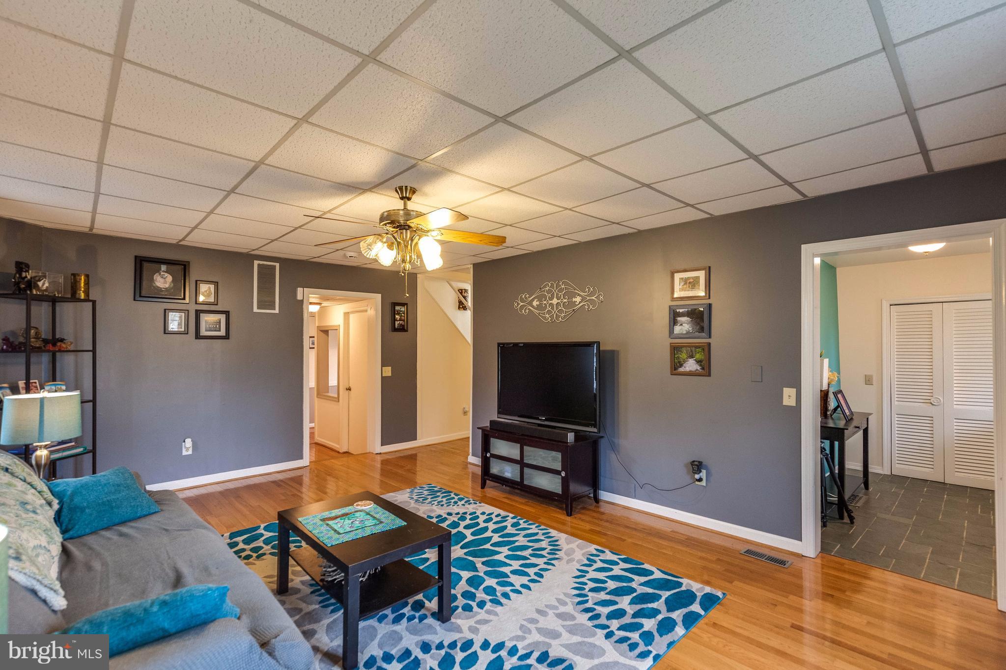 25453 Highfield Road Cascade, MD 21719 - Photo 10 of 30 a living room with furniture and a flat screen tv