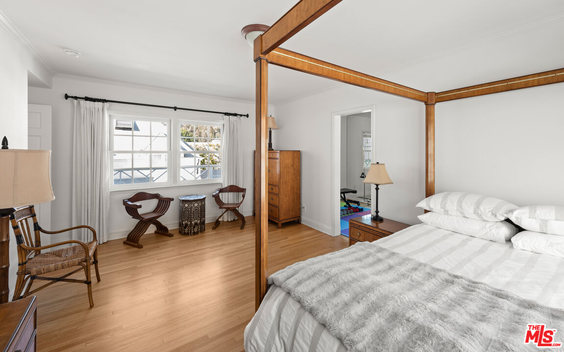 605 Palisades Beach Road Santa Monica, CA 90402 - Photo 23 of 33 a bedroom with furniture and a window