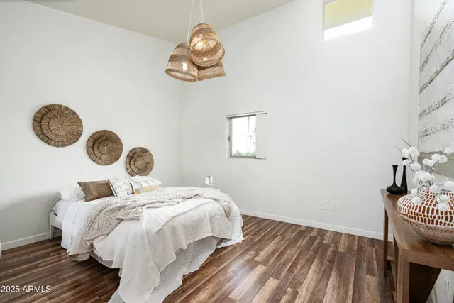 a bedroom with bed and a window