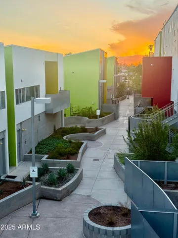 a view of a backyard with plants and a patio