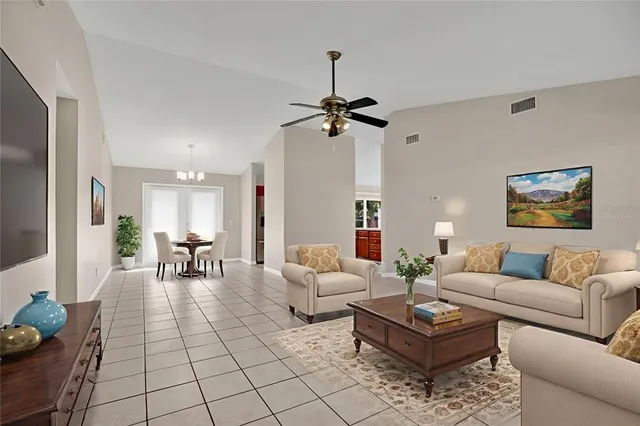 a living room with furniture a rug and a window