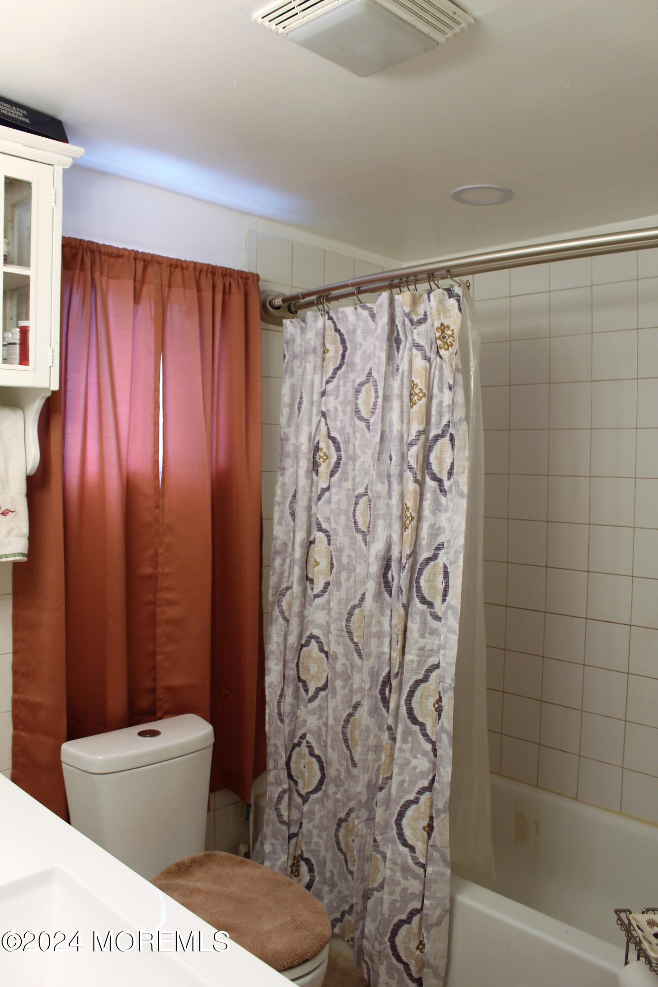 46 Toms River Road Jackson, NJ 08527 - Photo 12 of 16 a bathroom with a toilet and shower