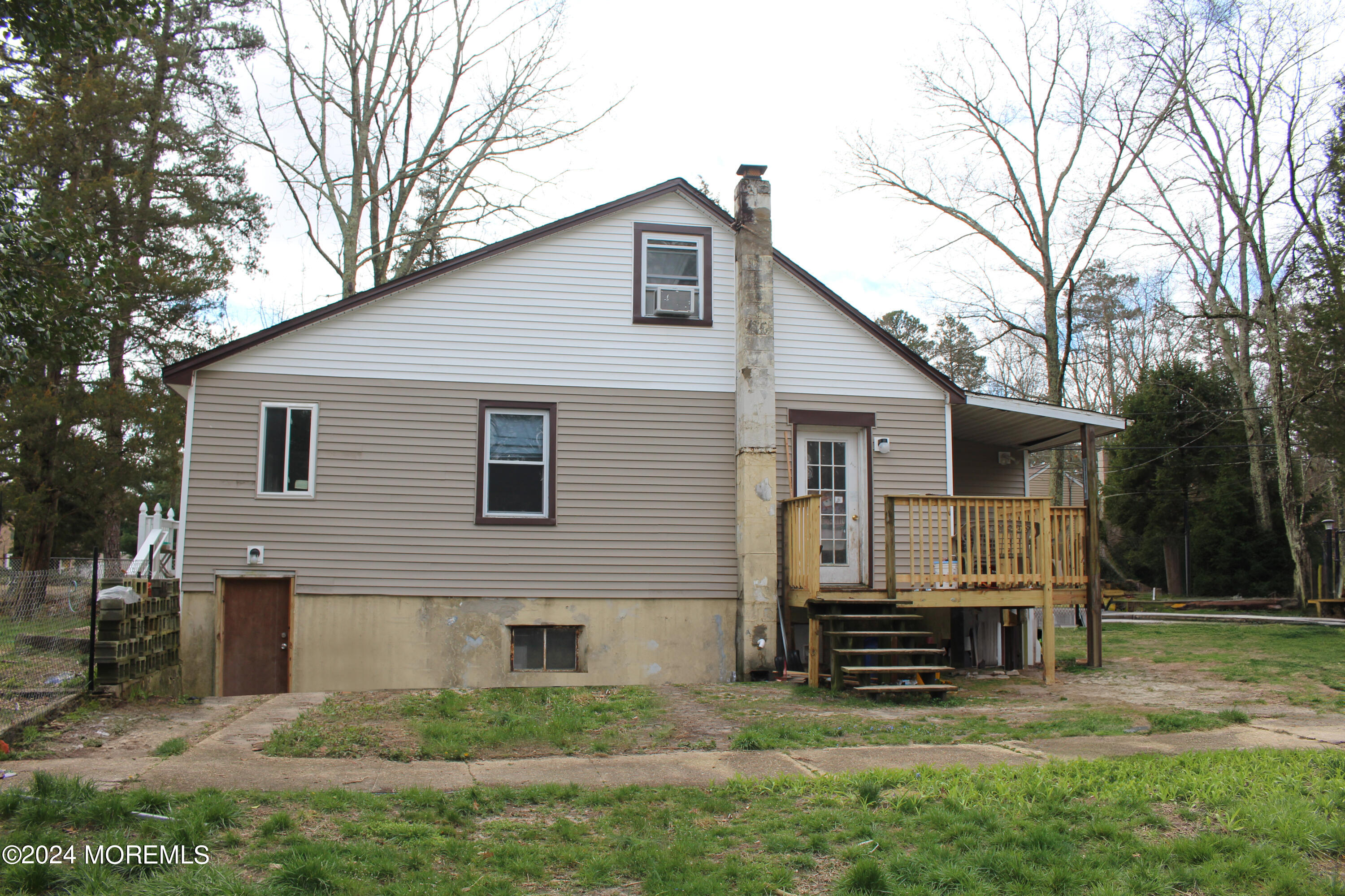 46 Toms River Road Jackson, NJ 08527 - Photo 3 of 16 a view of a house with a yard chairs and a large tree