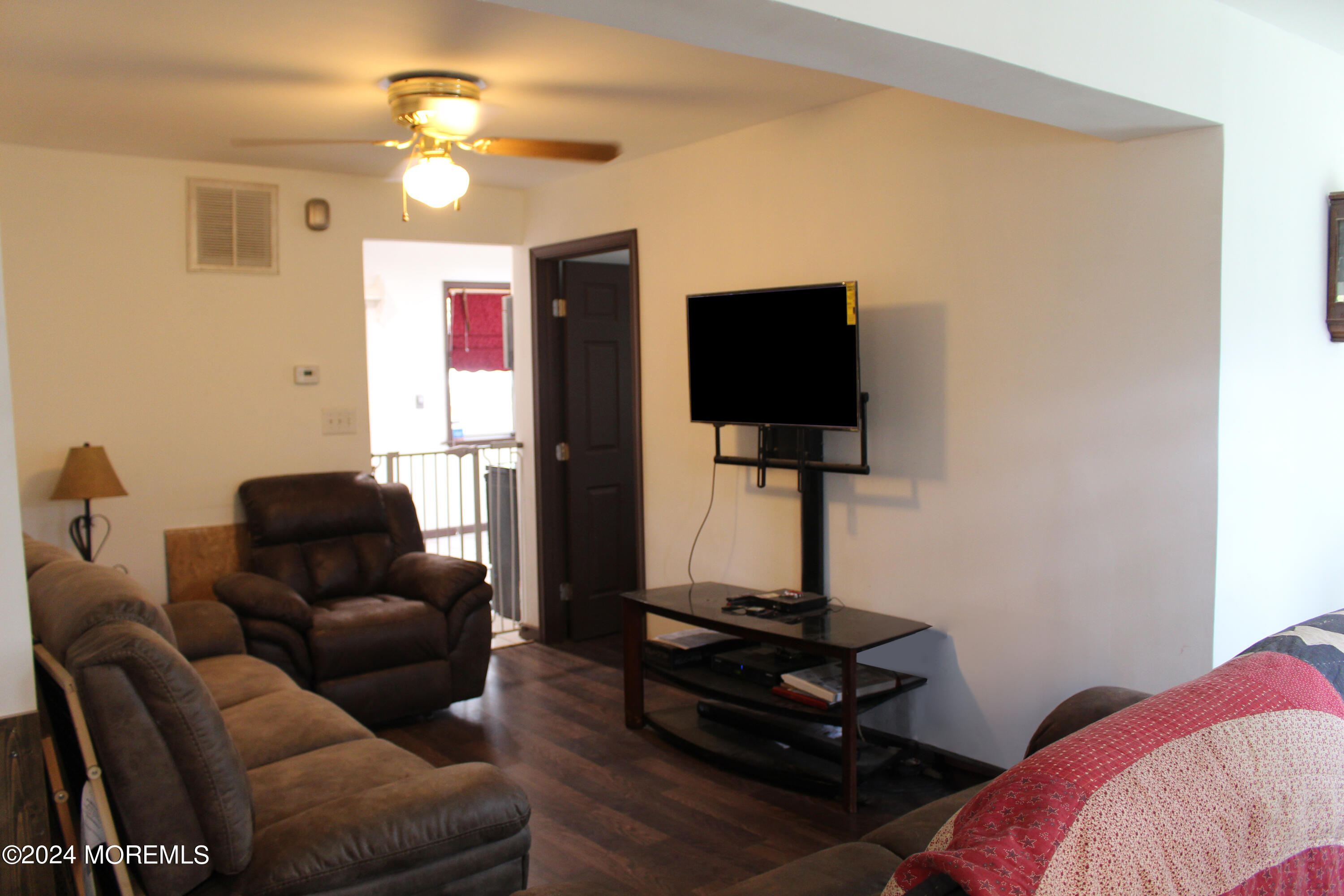 46 Toms River Road Jackson, NJ 08527 - Photo 4 of 16 a living room with furniture and a flat screen tv