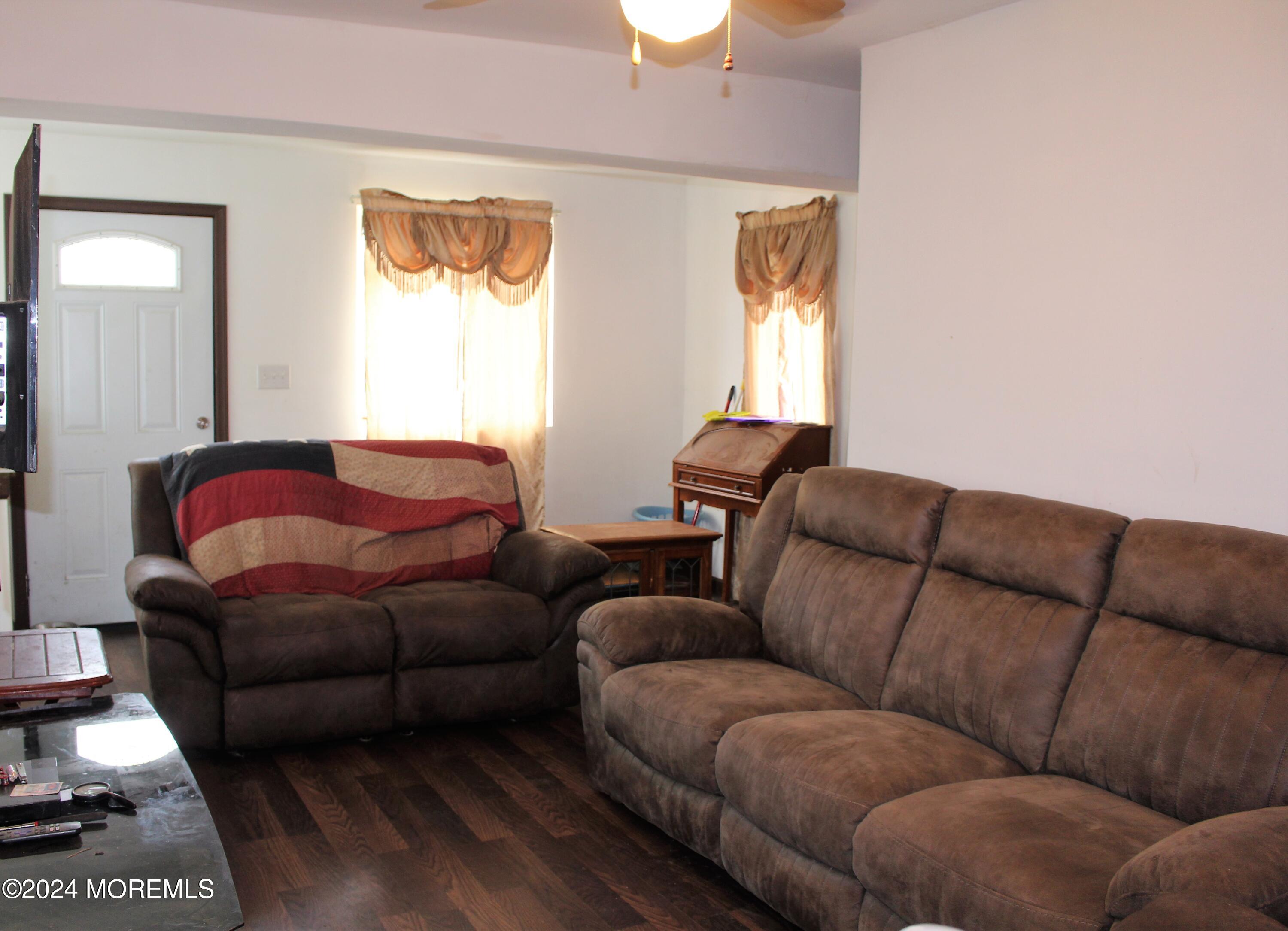 46 Toms River Road Jackson, NJ 08527 - Photo 5 of 16 a living room with furniture and a window