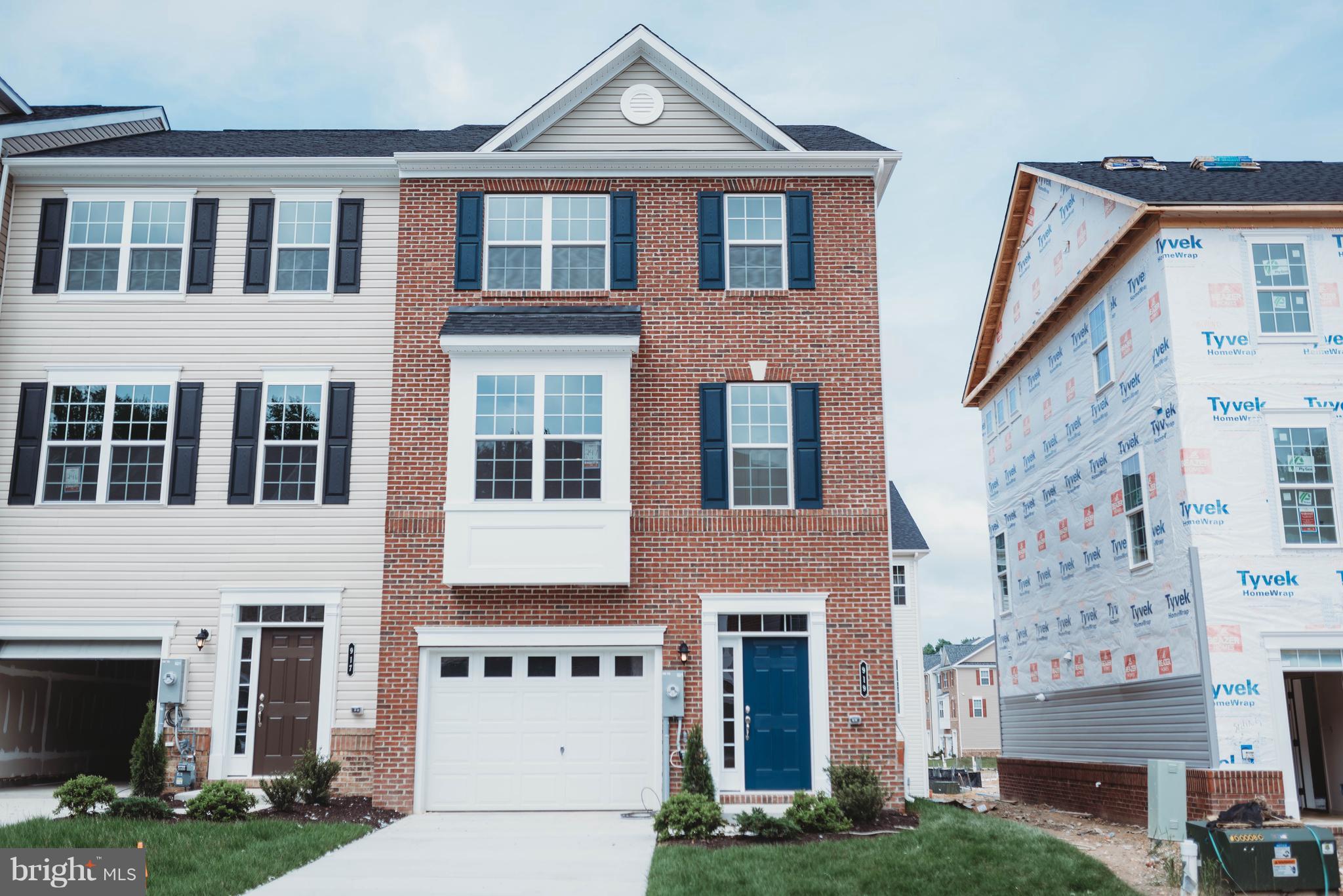 919 Morgan Run Road Baltimore, MD 21220 - Photo 1 of 16 a front view of a house with garden