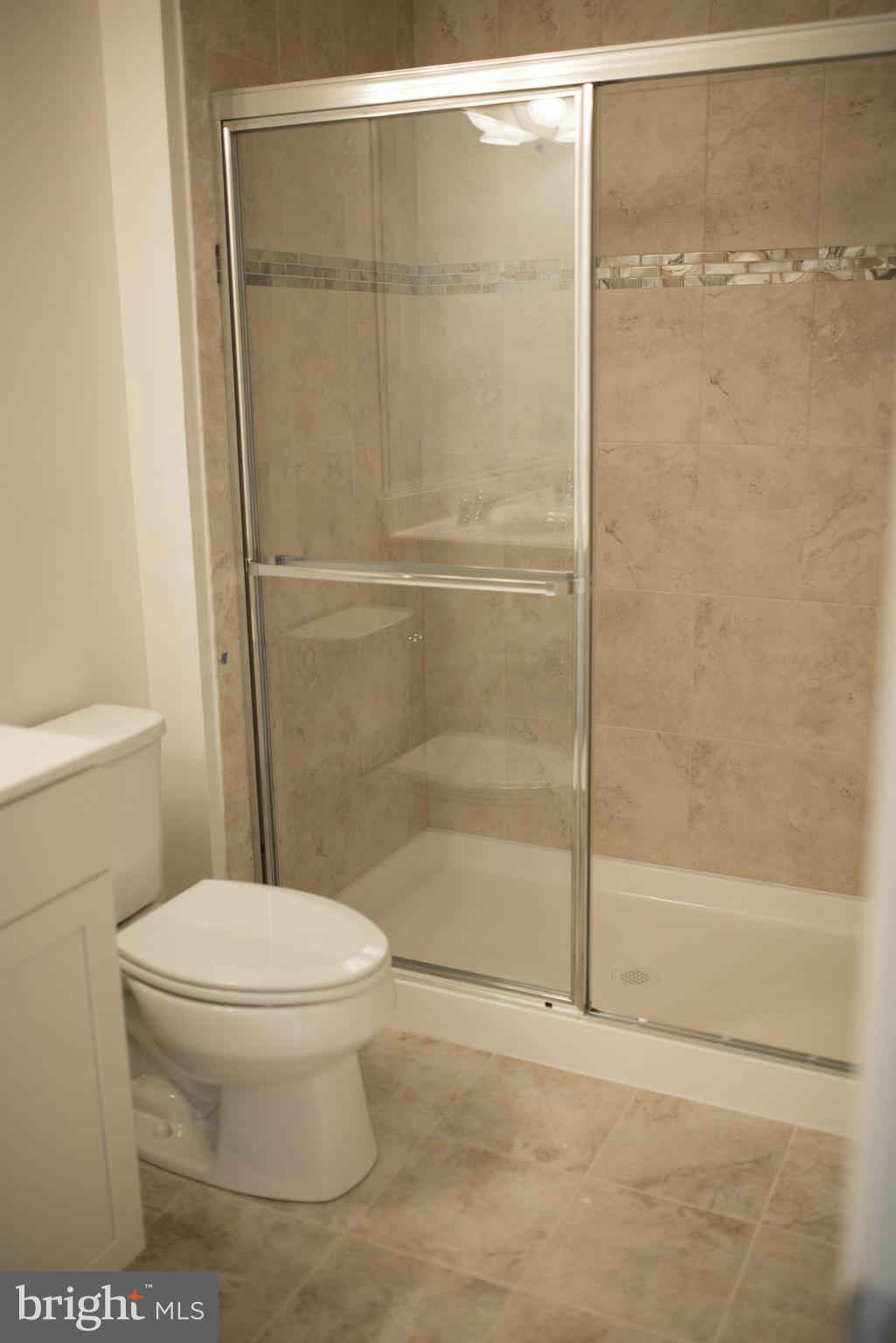 919 Morgan Run Road Baltimore, MD 21220 - Photo 16 of 16 a bathroom with a toilet and a shower