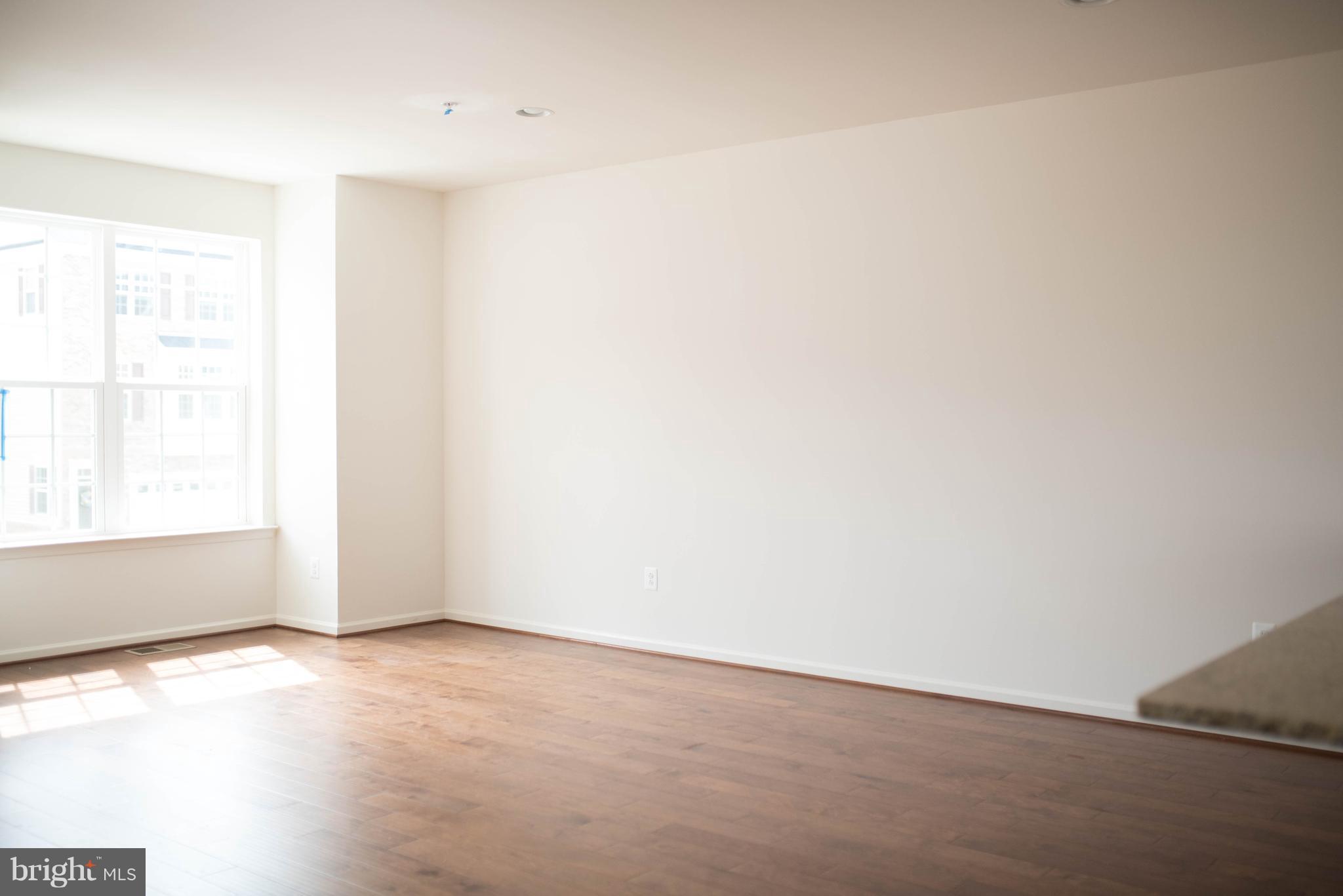 919 Morgan Run Road Baltimore, MD 21220 - Photo 7 of 16 a view of an empty room and window