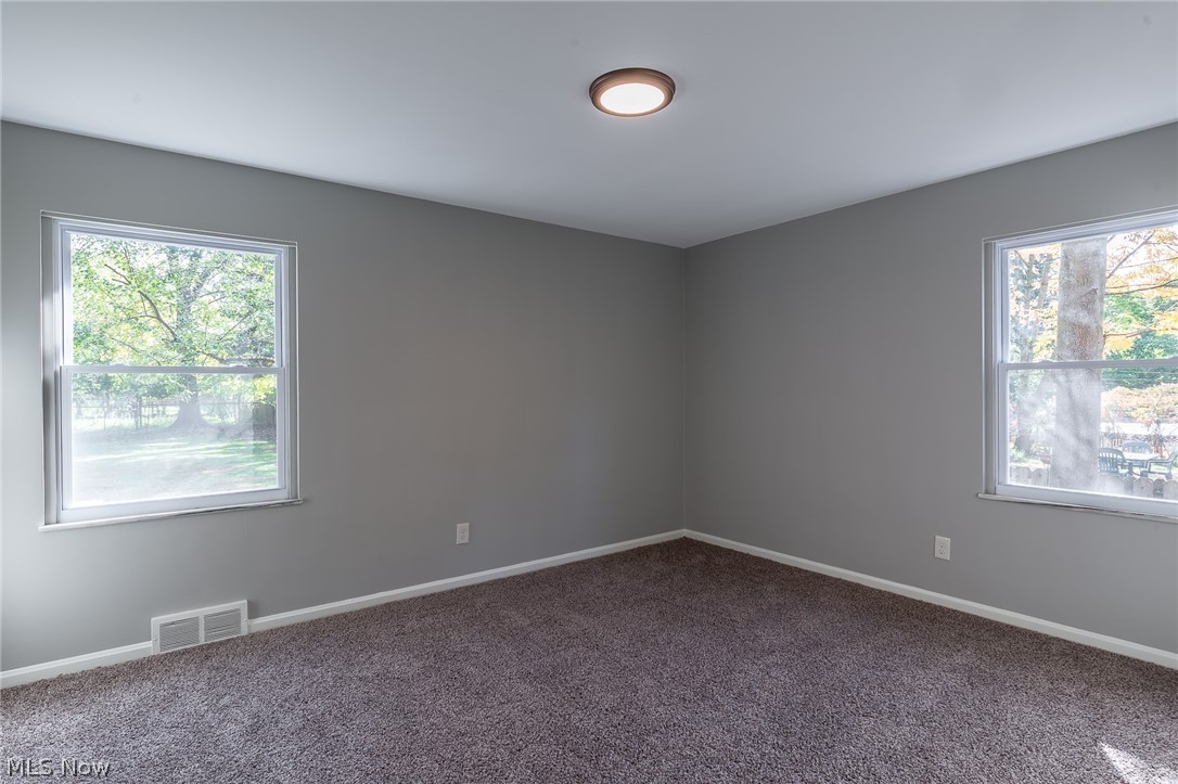 1393 Clearview Road Cleveland, OH 44124 - Photo 11 of 35 One of three bedrooms on the first floor, this corner room is 12x14, new carpeting, lots of natural light.