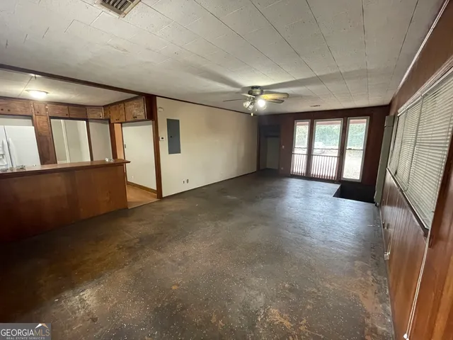 a view of livingroom with hardwood floor and windows