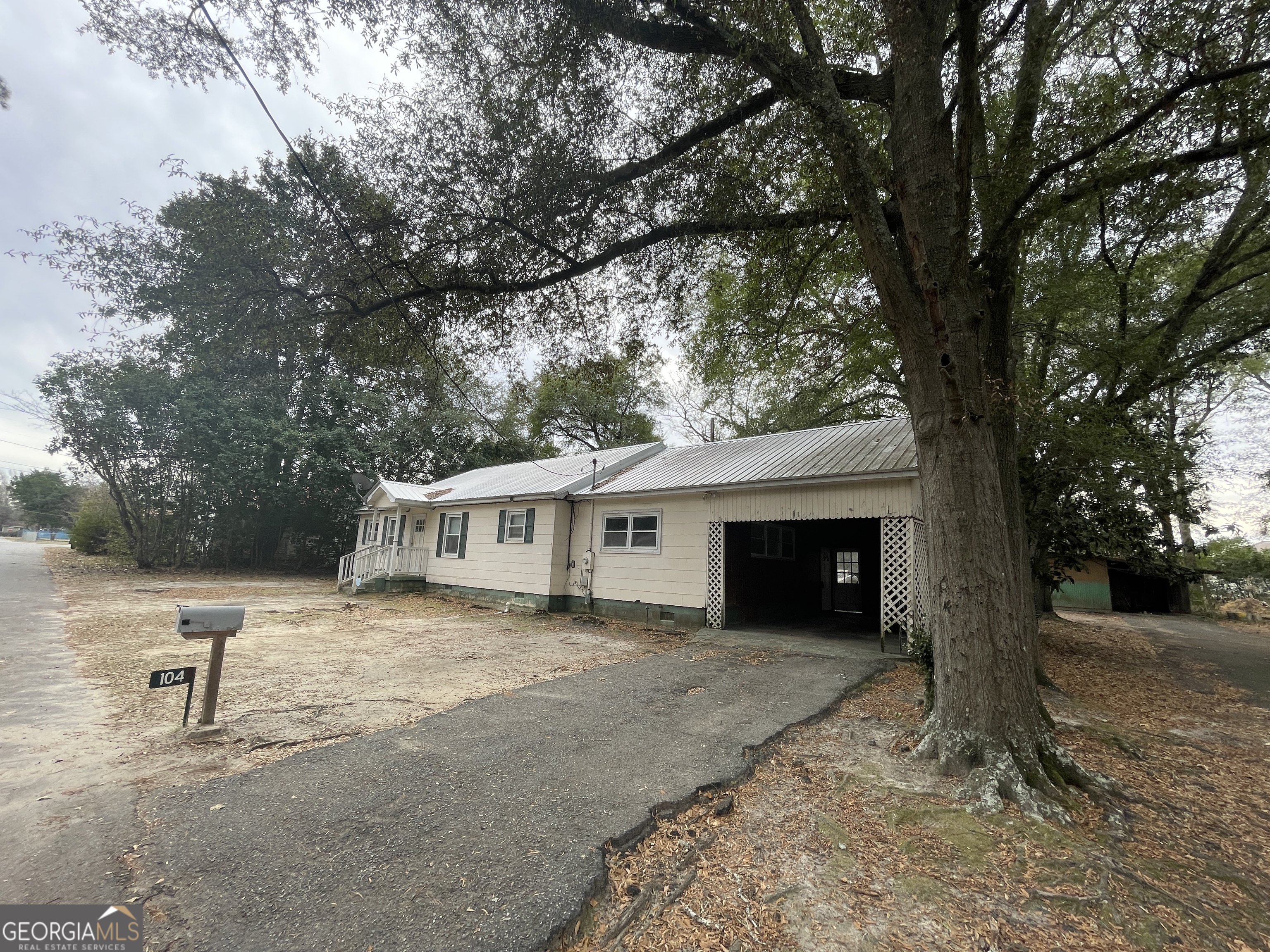 104 4th Street Cochran, GA 31014 - Photo 38 of 41 a view of a house with a yard and large tree