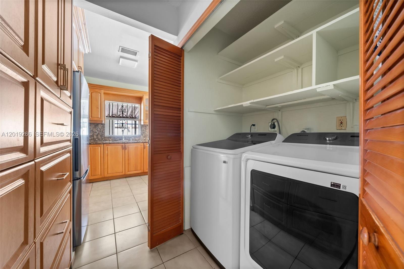 13 Southwest 97th Place Miami, FL 33174 - Photo 14 of 29 a utility room with dryer and washer
