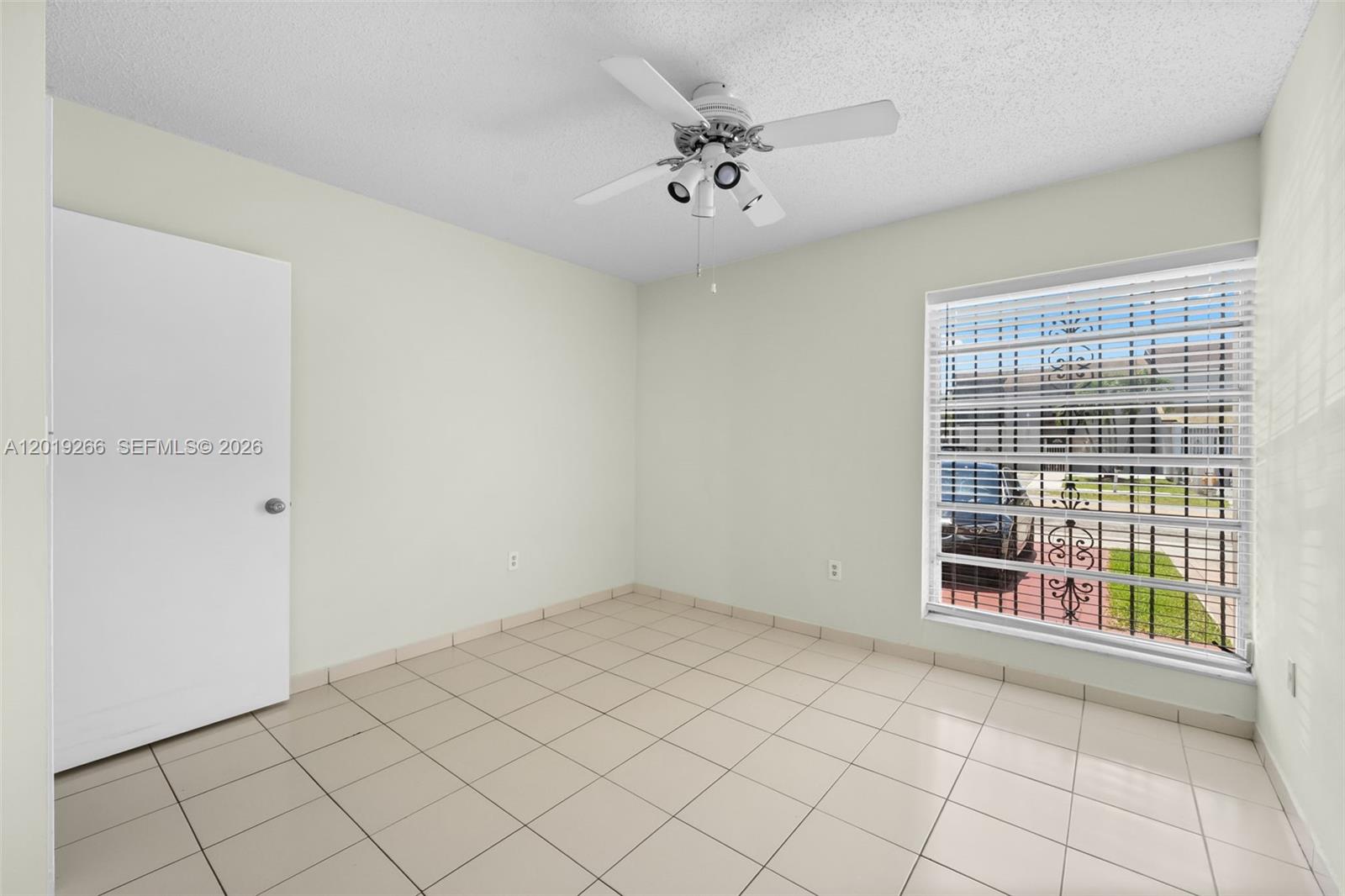 13 Southwest 97th Place Miami, FL 33174 - Photo 17 of 29 a view of an empty room with a window