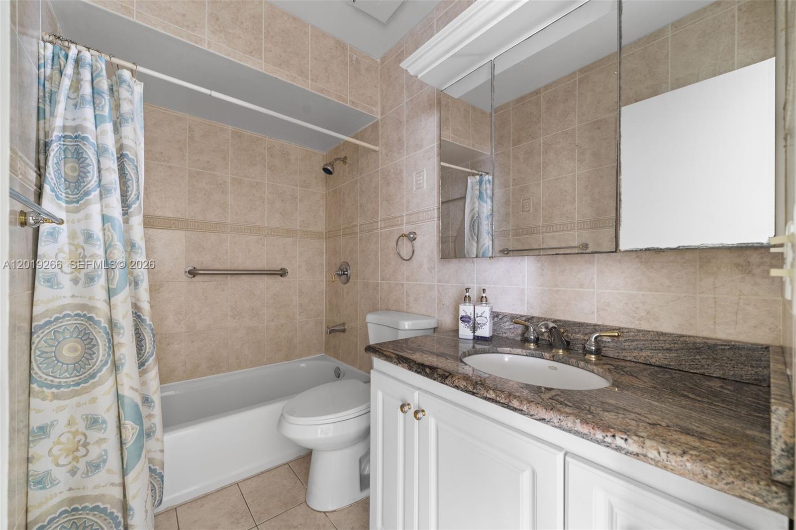 13 Southwest 97th Place Miami, FL 33174 - Photo 19 of 29 a bathroom with a granite countertop sink a toilet and shower