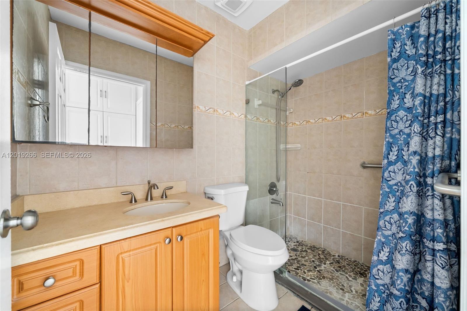 13 Southwest 97th Place Miami, FL 33174 - Photo 24 of 29 a bathroom with a sink a toilet and shower
