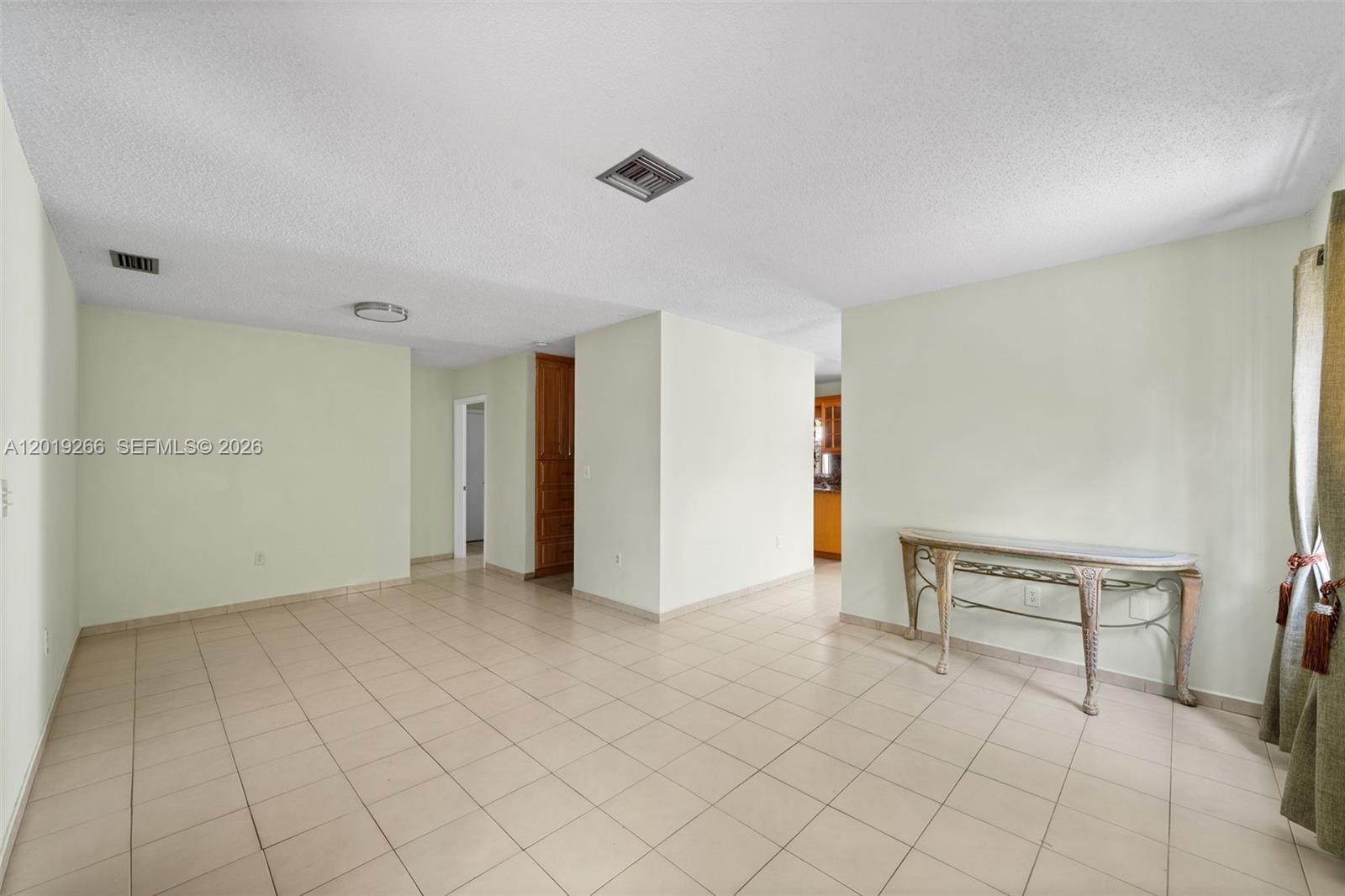 13 Southwest 97th Place Miami, FL 33174 - Photo 5 of 29 a view of an empty room with a window