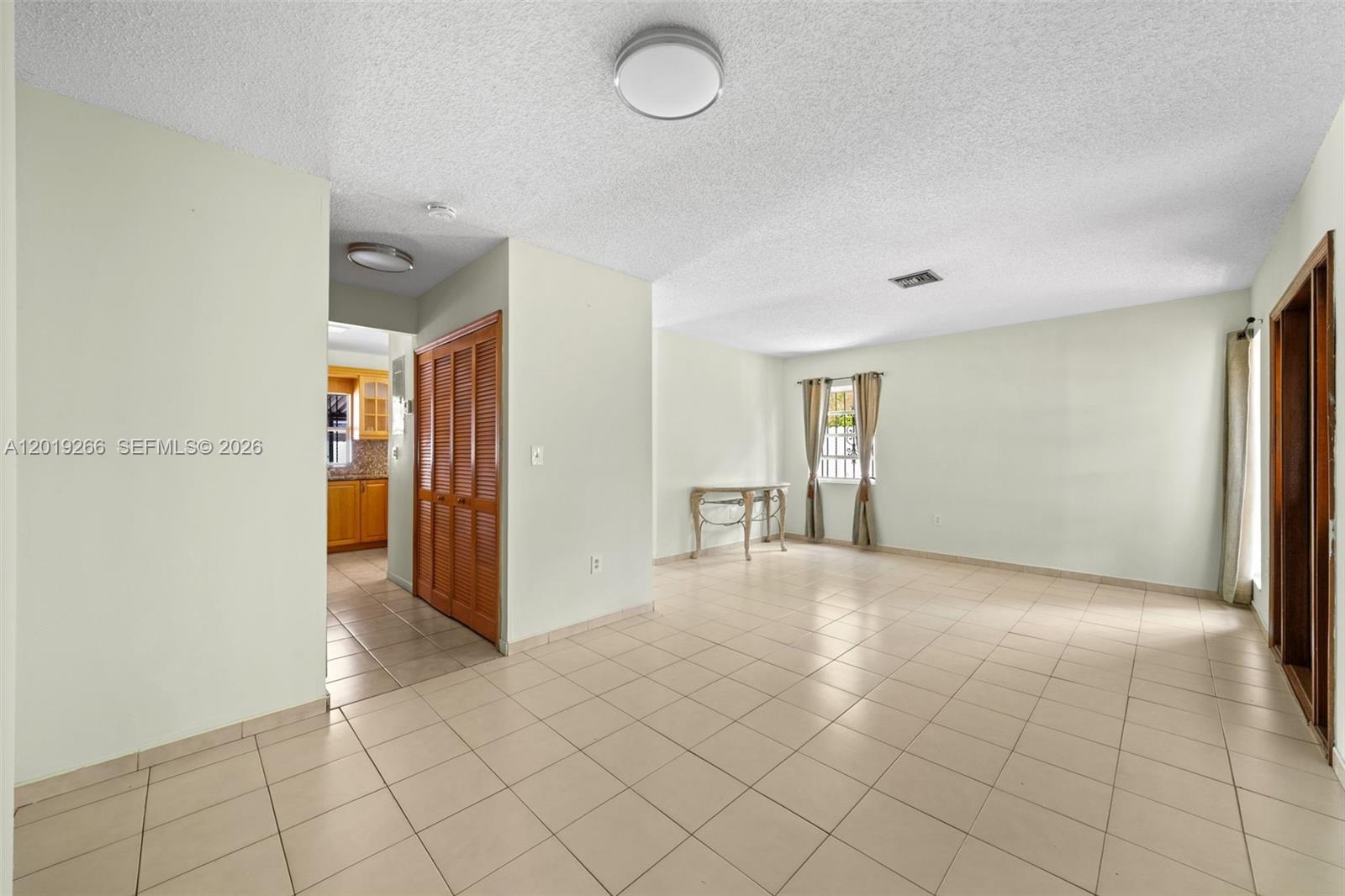 13 Southwest 97th Place Miami, FL 33174 - Photo 6 of 29 a view of an empty room and window