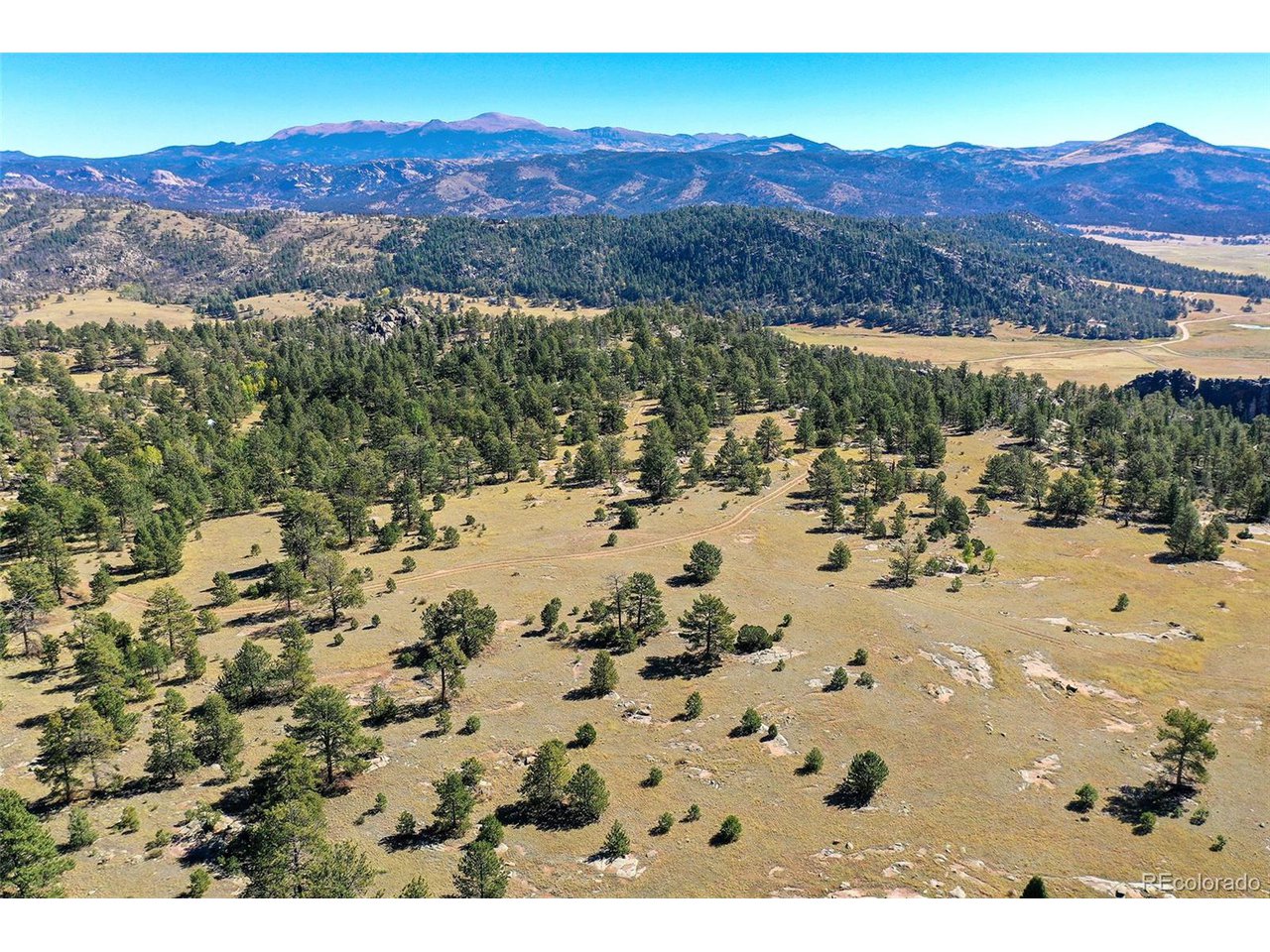 Carl Road Florissant, CO 80816 - Photo 31 of 37 a view of a mountain with a lake