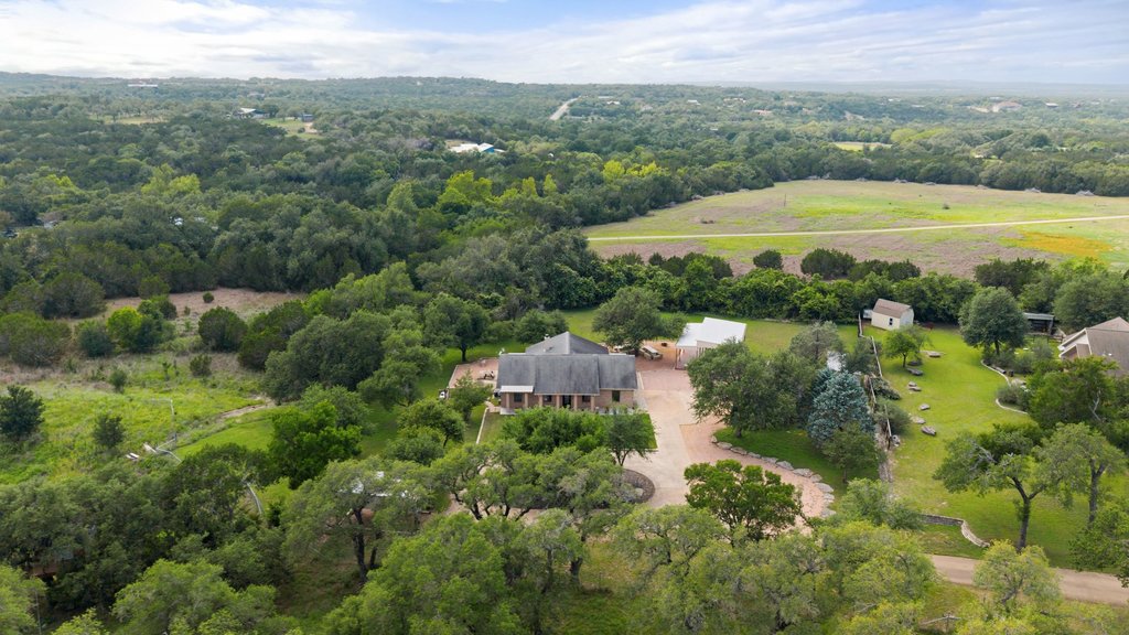 12135 Fitzhugh Road Austin, TX 78736 - Photo 15 of 30 a view of a garden with a building in the background