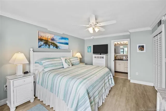 a bathroom with a granite countertop sink a toilet a shower and a mirror