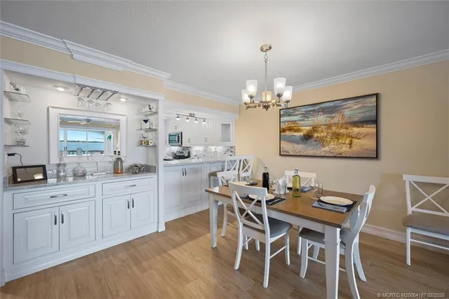 a kitchen with stainless steel appliances granite countertop a white stove top oven and cabinets