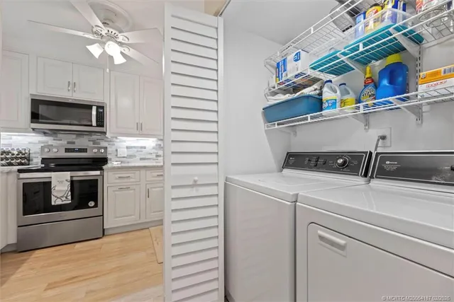 a white refrigerator freezer sitting in a kitchen