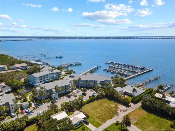 an aerial view of a house with a lake view