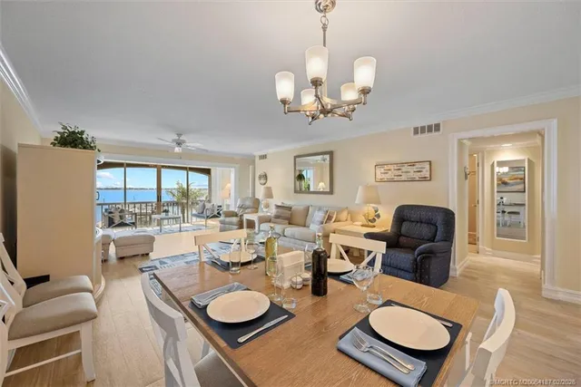 a living room with lots of furniture and a chandelier