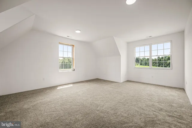 a balcony with furniture and garden view