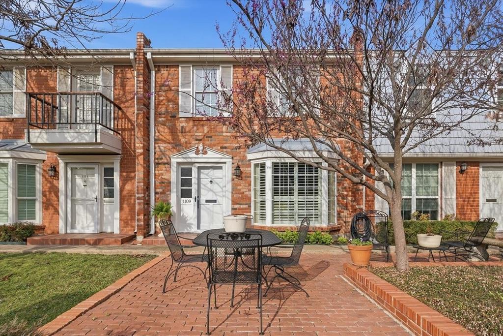a view of a house with backyard porch and sitting area