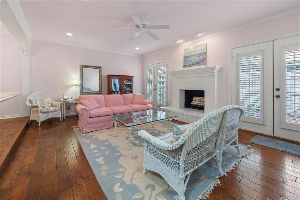 1109 Roaring Springs Road, Unit 1109 Fort Worth, TX 76114 - Photo 14 of 35 a living room with furniture a fireplace and wooden floor