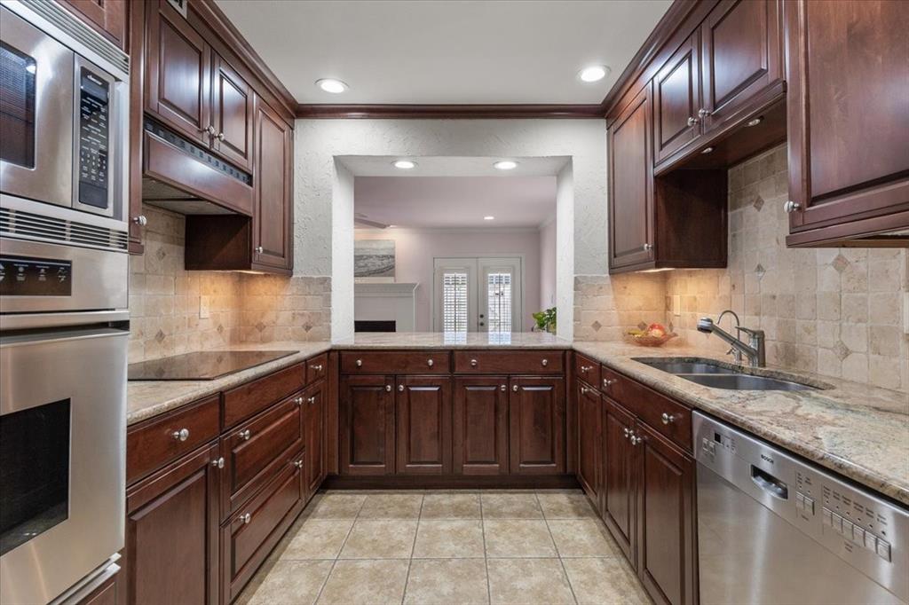 1109 Roaring Springs Road, Unit 1109 Fort Worth, TX 76114 - Photo 18 of 35 a kitchen with a sink and cabinets