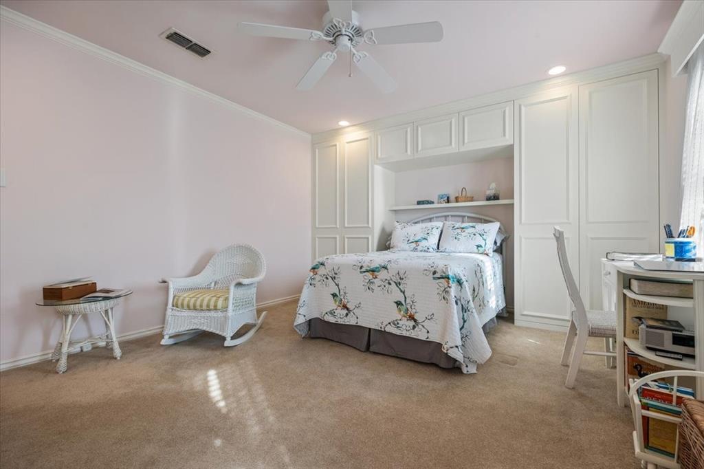 1109 Roaring Springs Road, Unit 1109 Fort Worth, TX 76114 - Photo 26 of 35 a bedroom with a bed a chair and the chandelier
