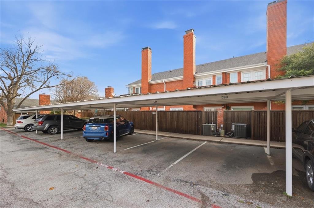 1109 Roaring Springs Road, Unit 1109 Fort Worth, TX 76114 - Photo 32 of 35 a roof deck with table and chairs and wooden fence
