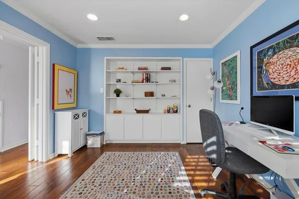a workspace with furniture and wooden floor