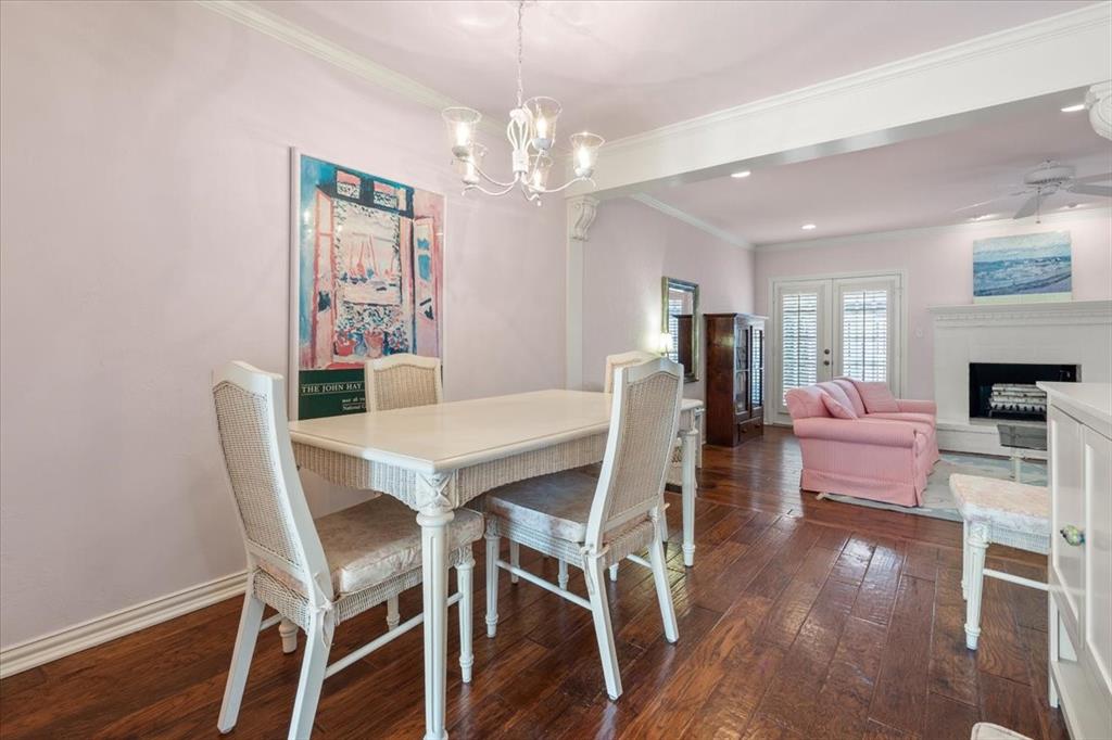 1109 Roaring Springs Road, Unit 1109 Fort Worth, TX 76114 - Photo 9 of 35 a view of a dining room with furniture and wooden floor