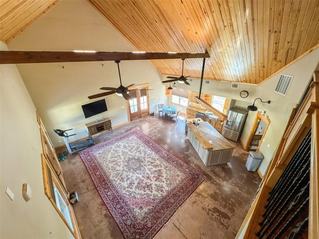 423 Hcr 1439 Covington, TX 76636 - Photo 11 of 40 a living room with a rug