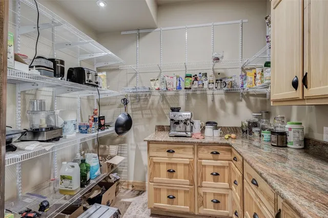 a bedroom with furniture and wooden floor