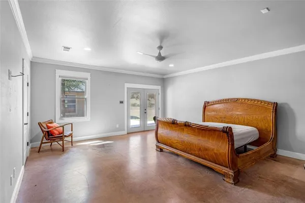 a bathroom with a granite countertop sink a mirror and shower