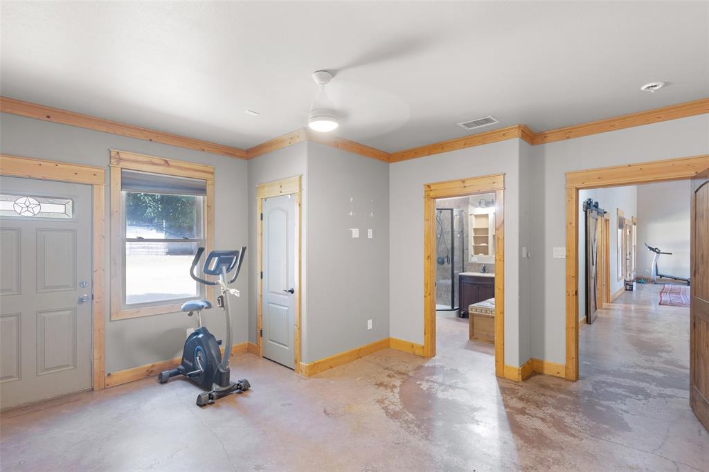 423 Hcr 1439 Covington, TX 76636 - Photo 19 of 40 a view of a room with gym equipment