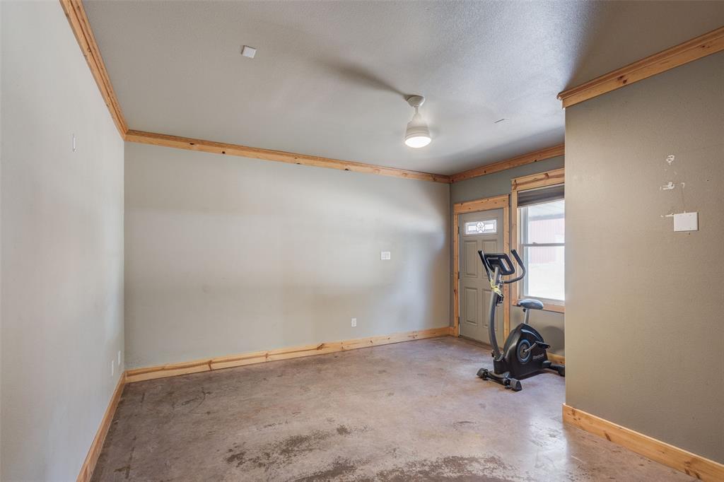 423 Hcr 1439 Covington, TX 76636 - Photo 20 of 40 a view of a room with gym equipment