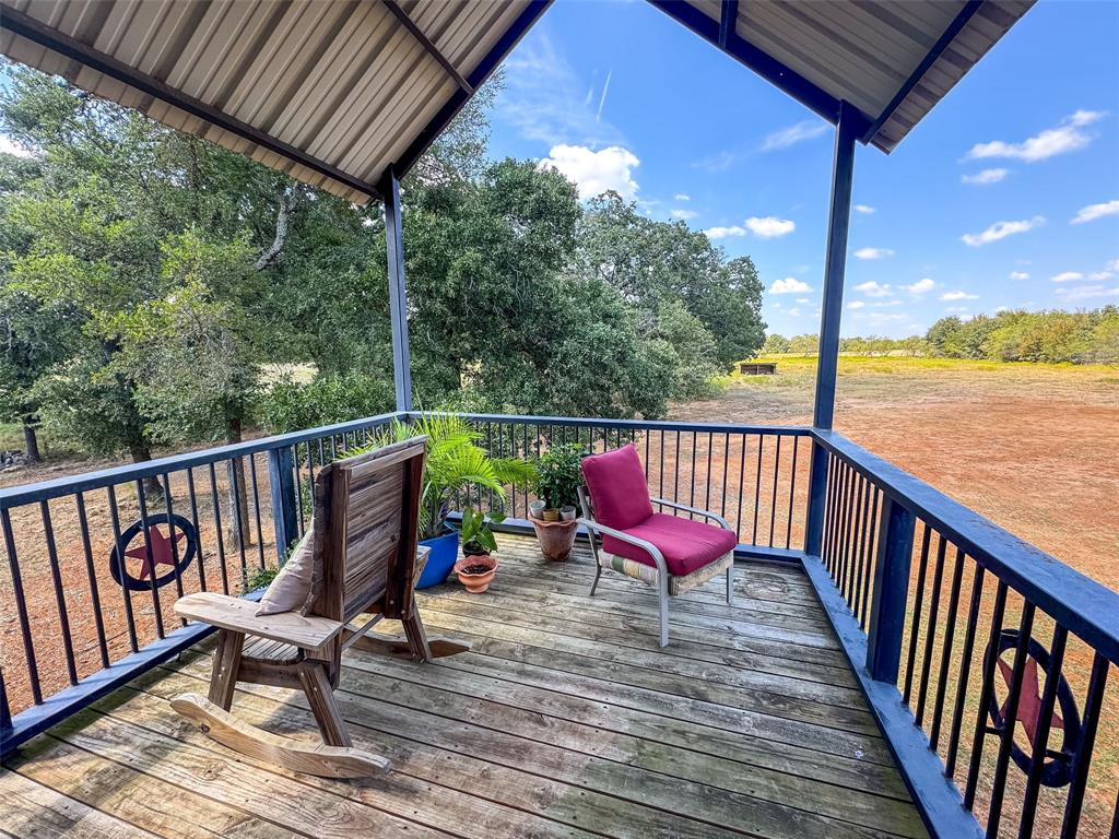 423 Hcr 1439 Covington, TX 76636 - Photo 28 of 40 a view of a two chairs in the balcony