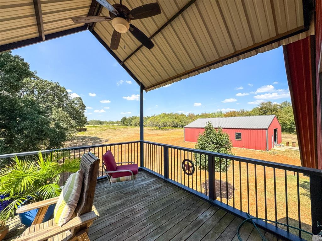 423 Hcr 1439 Covington, TX 76636 - Photo 30 of 40 a view of a balcony with wooden floor