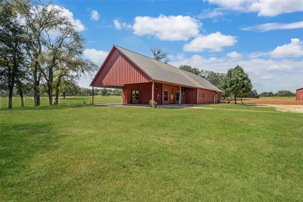 a view of a house with a big yard