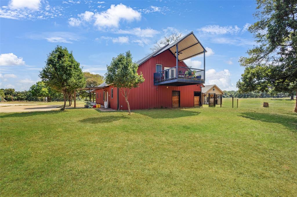 423 Hcr 1439 Covington, TX 76636 - Photo 31 of 40 a front view of a house with garden