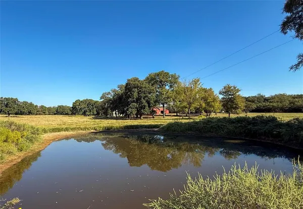 a view of lake with green space