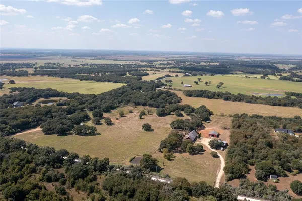 a living room with lots of furniture and wooden floor