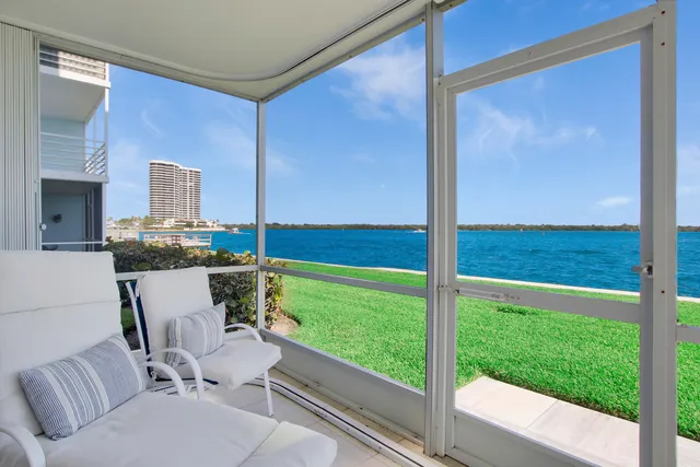 a view of a porch with furniture and garden
