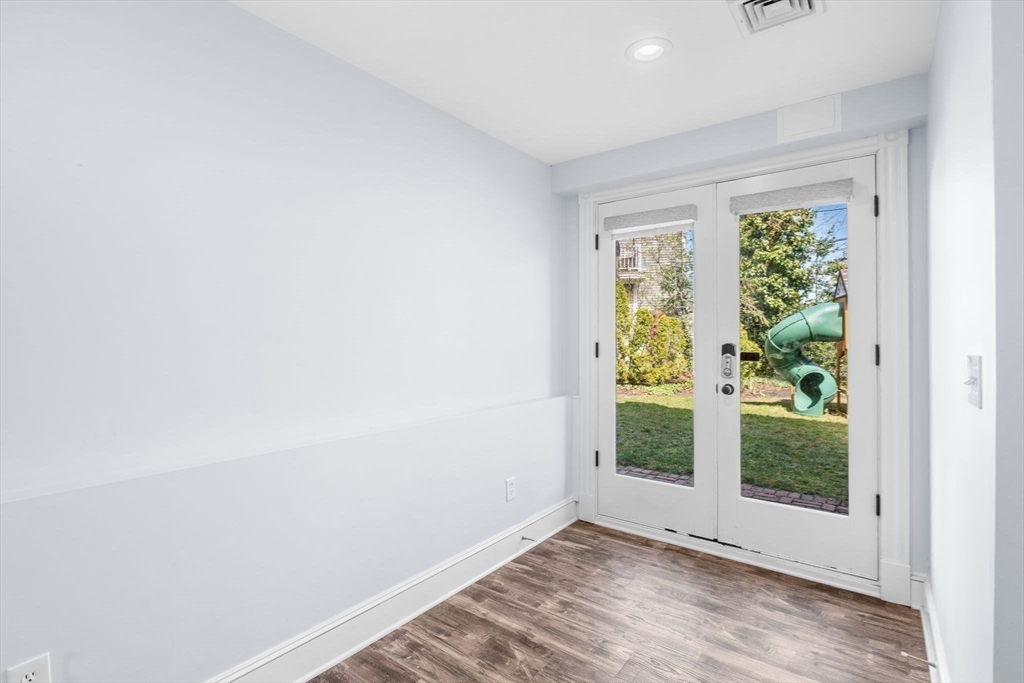90 Puritan Road Swampscott, MA 01907 - Photo 35 of 42 a view of an empty room with wooden floor and a window